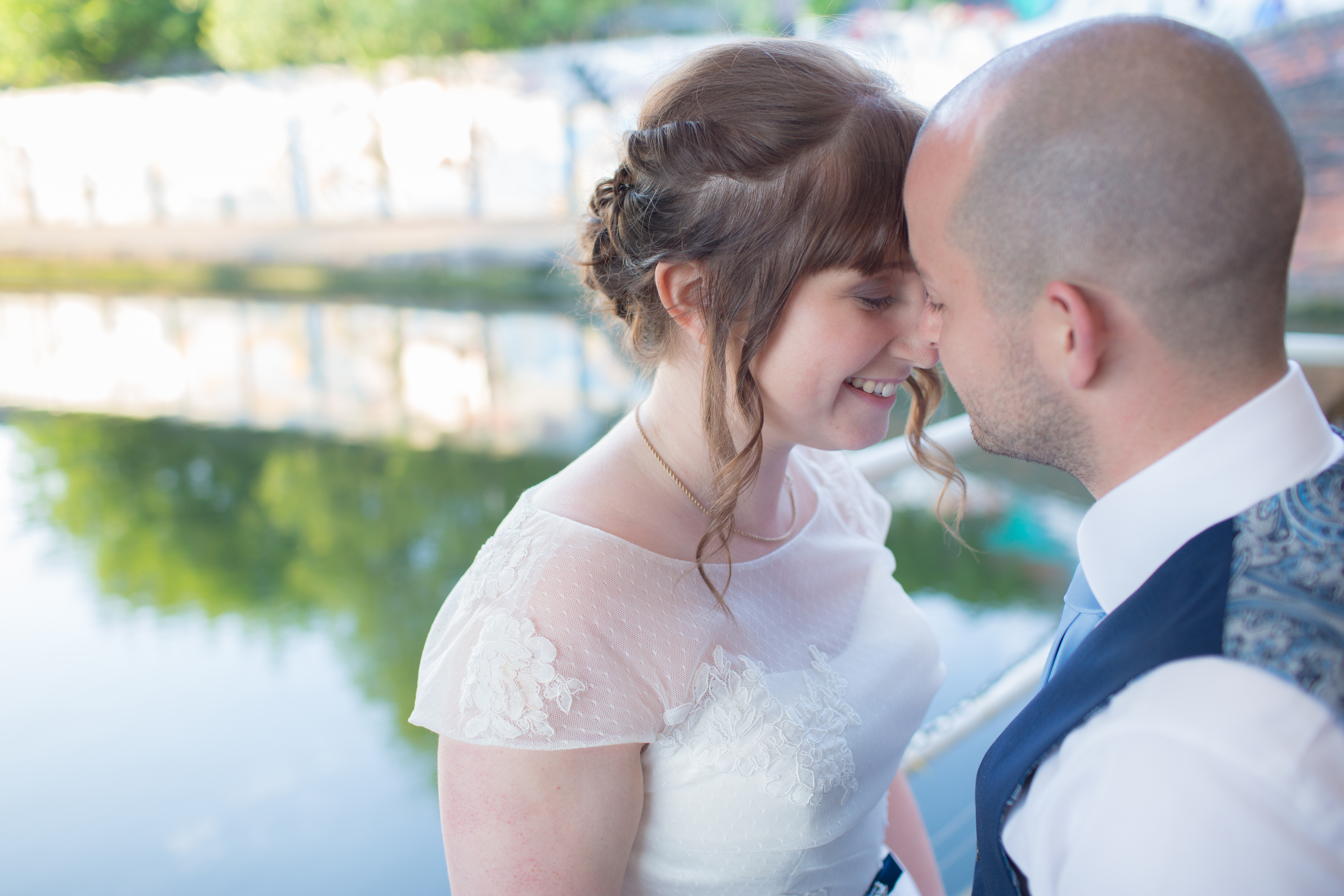 bride and groom at the bond company by canal