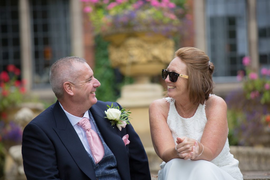 bride wearing grooms sunglasses