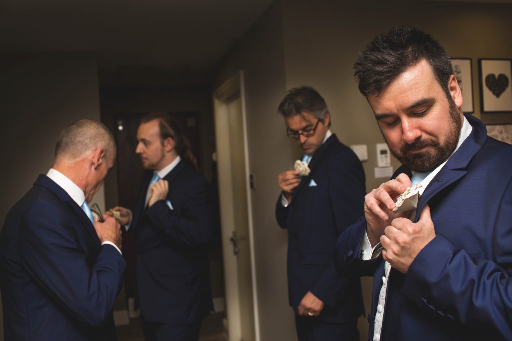 Groom getting ready with ushers