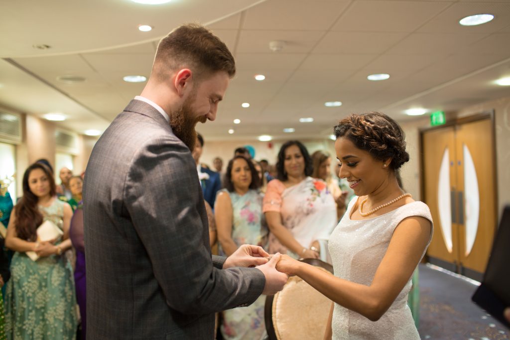 exchange of wedding rings during ceremony