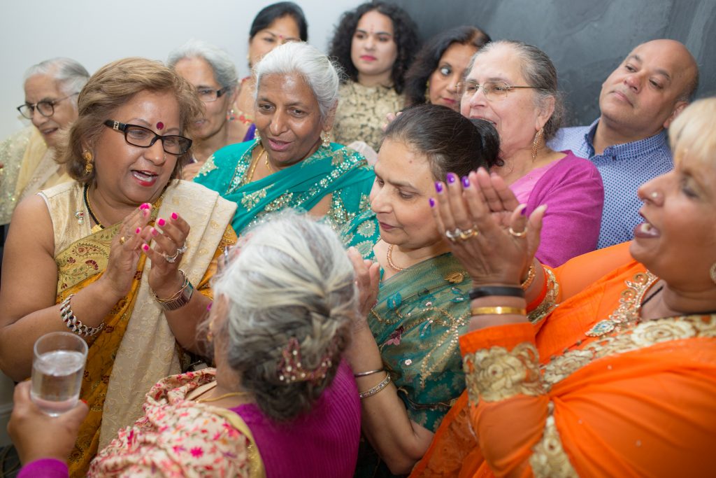 Ladies dressed in saris singing
