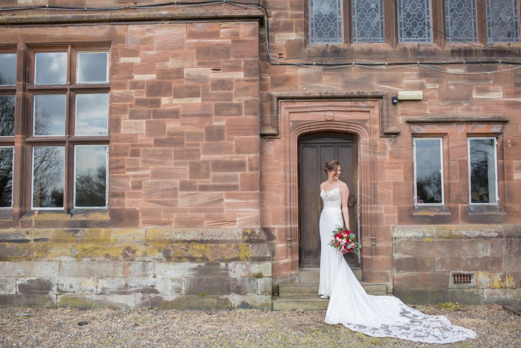 Photo of bride taken stood by door at Standon Hall