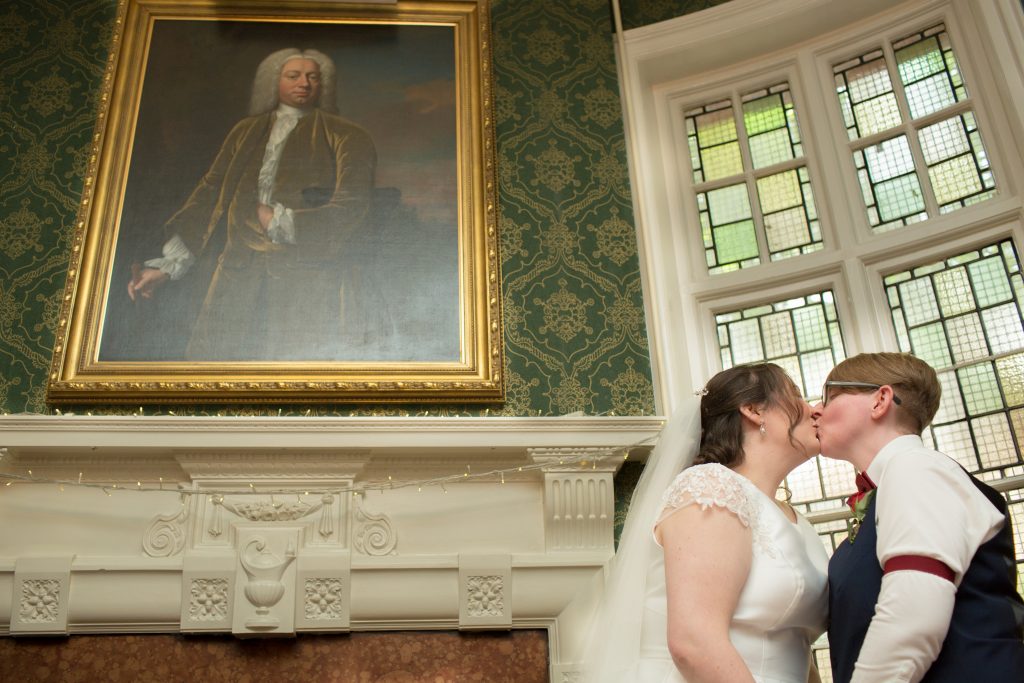 two brides kissing after getting married