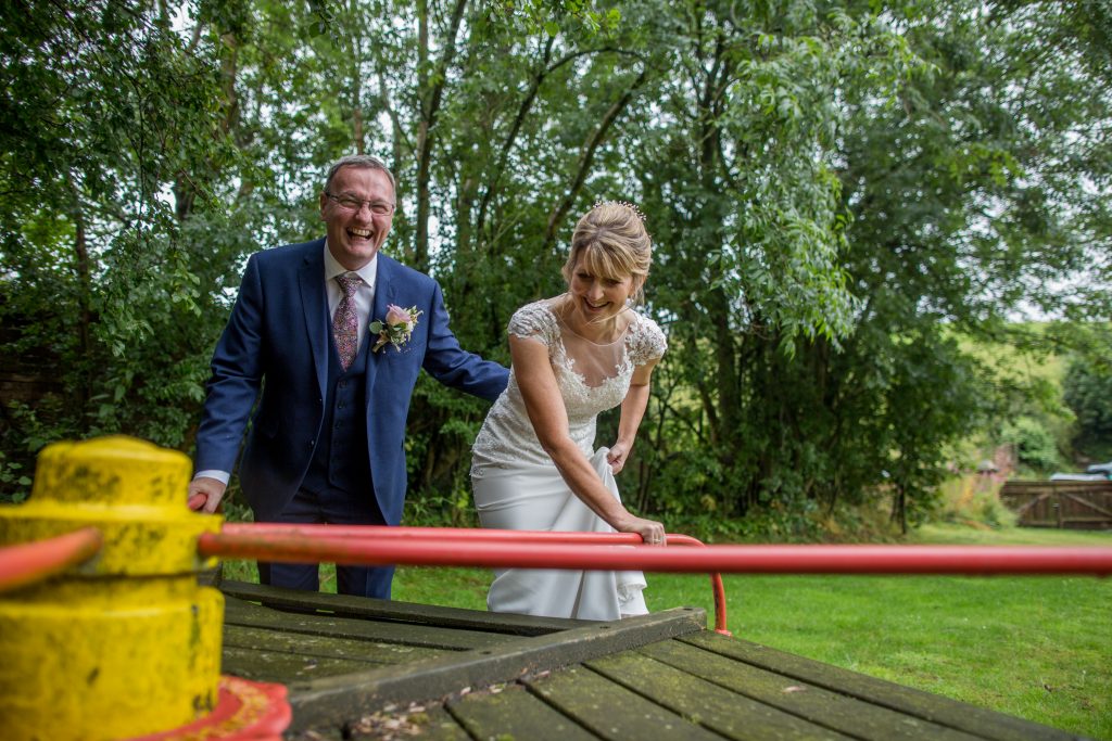 bride and groom on a roundabout