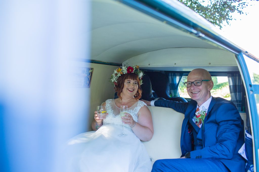 bride and dad sat in back of camper van