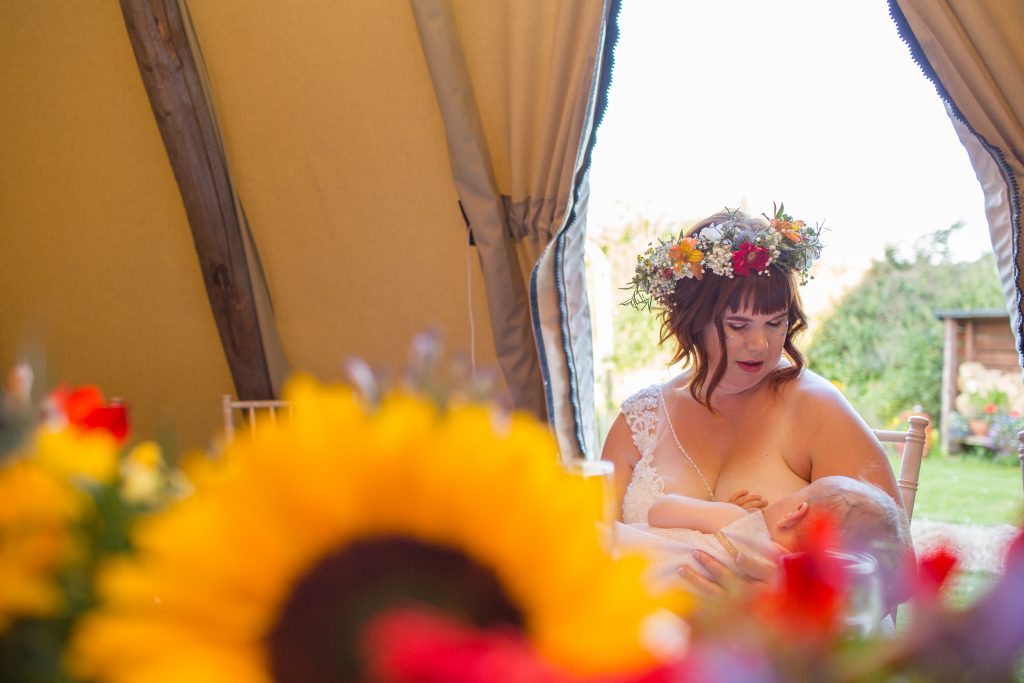 bride breastfeeding baby at the wroxeter hotel