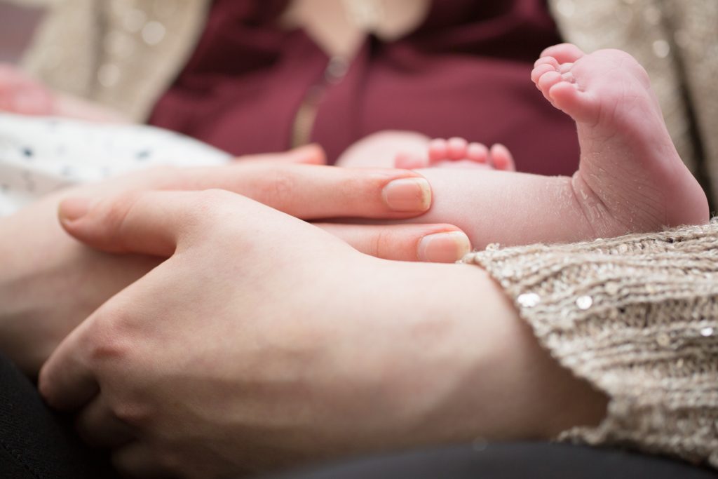 mother holding baby