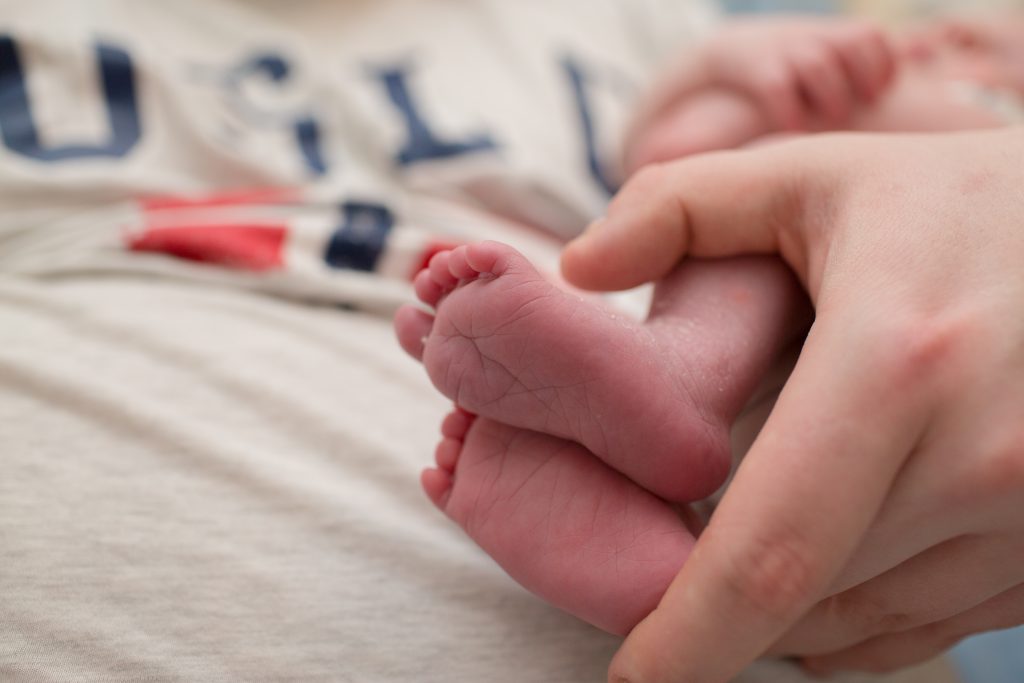 close up photo of babies feet