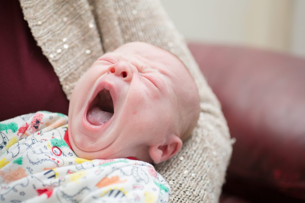 newborn baby yawning