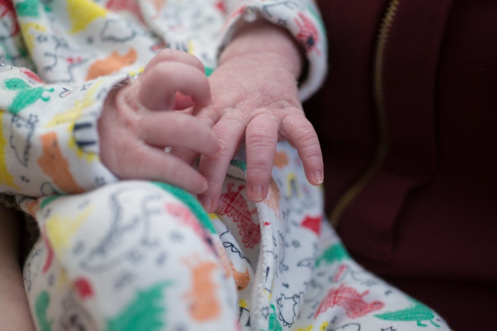 close up photo of newborns hands