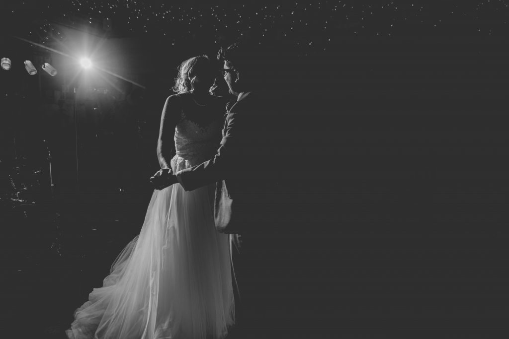 black and white photo of couple doing first dance