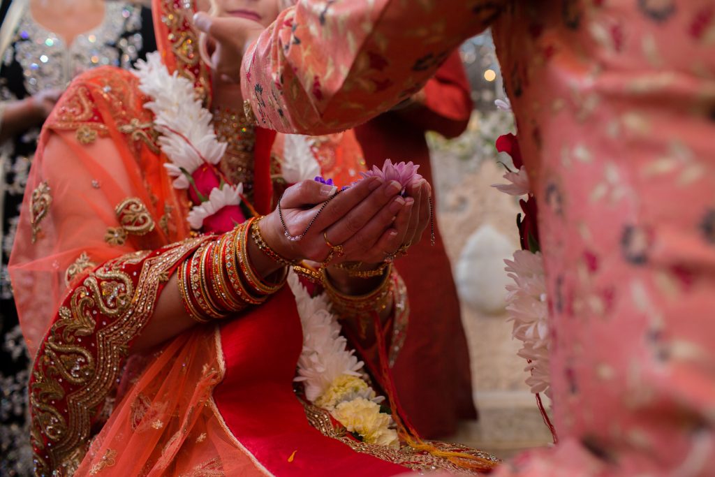 close up picture of hands during hindu ceremony