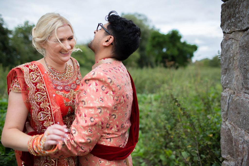 bride and groom laughing together