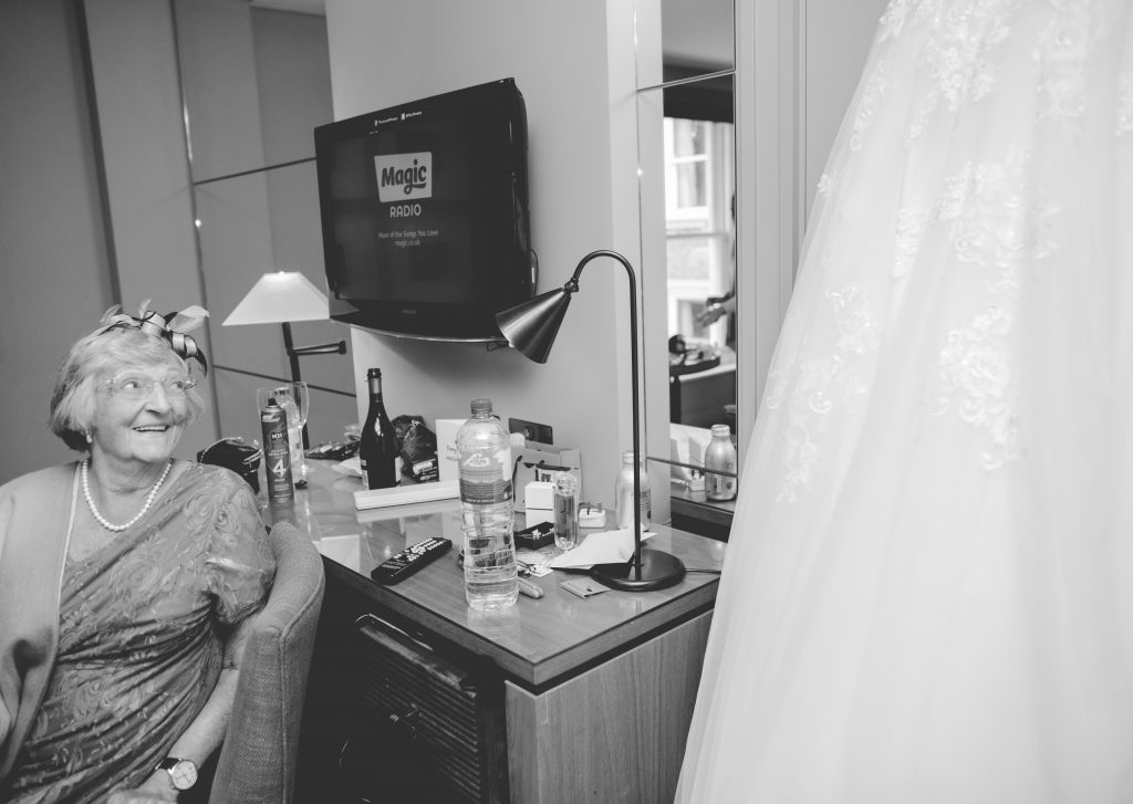 grandma looking at wedding dress