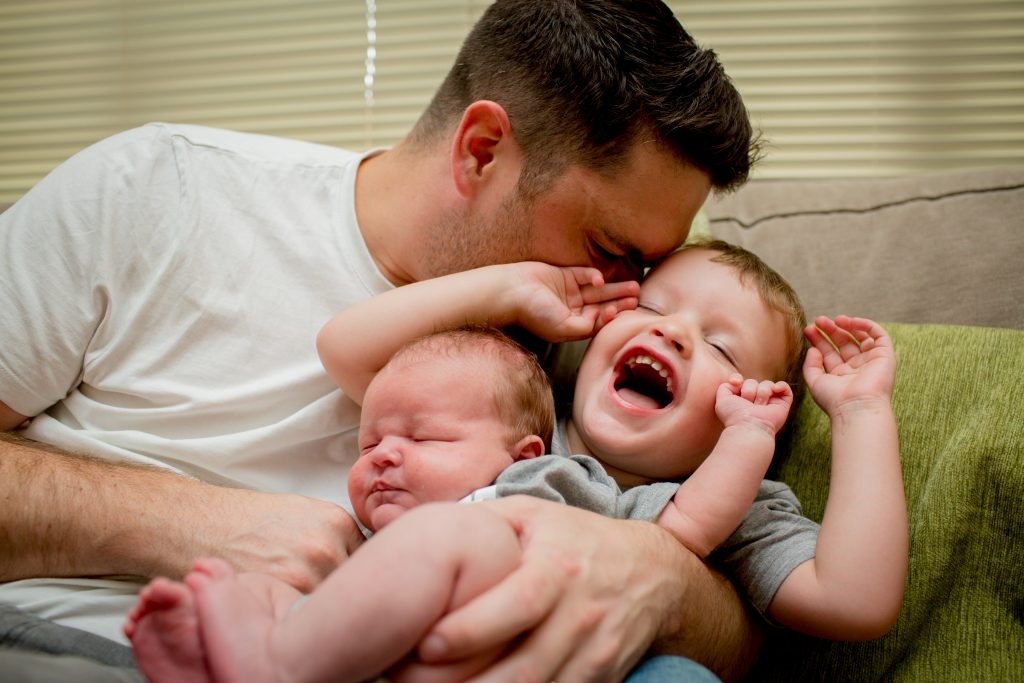 dad making son laugh