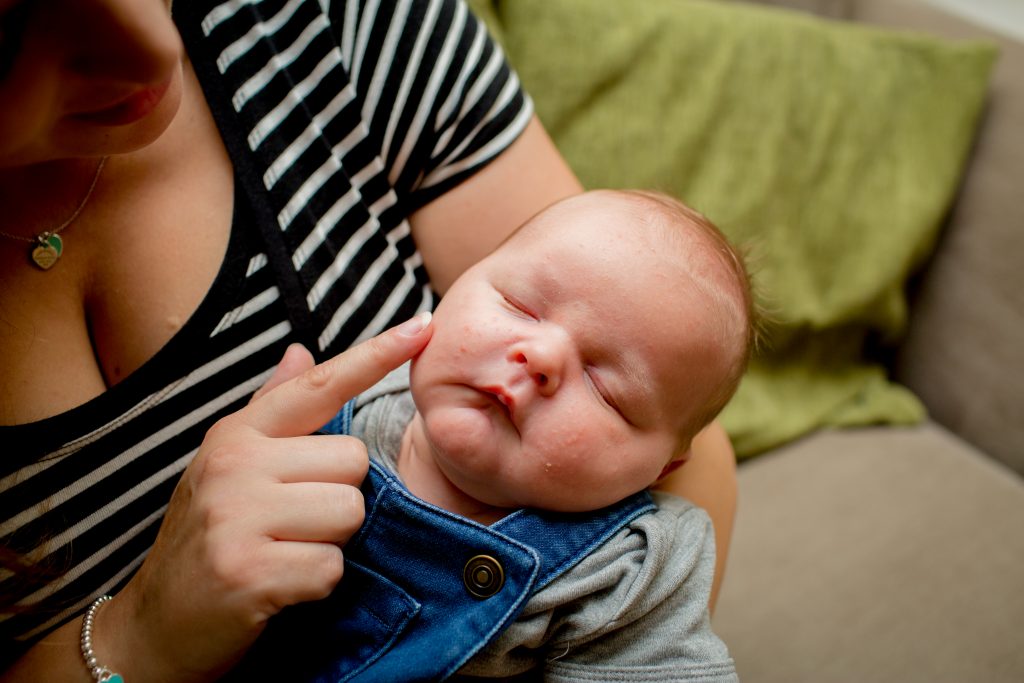 mum touching sons cheek with finger