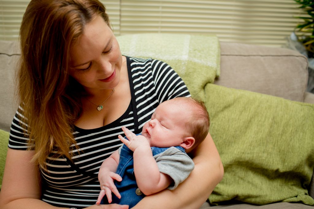 mum looking at newborn son