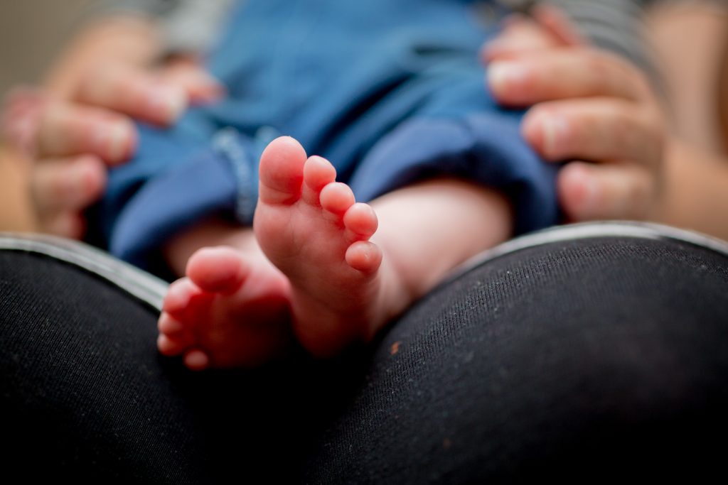 close up photo of newborns feet