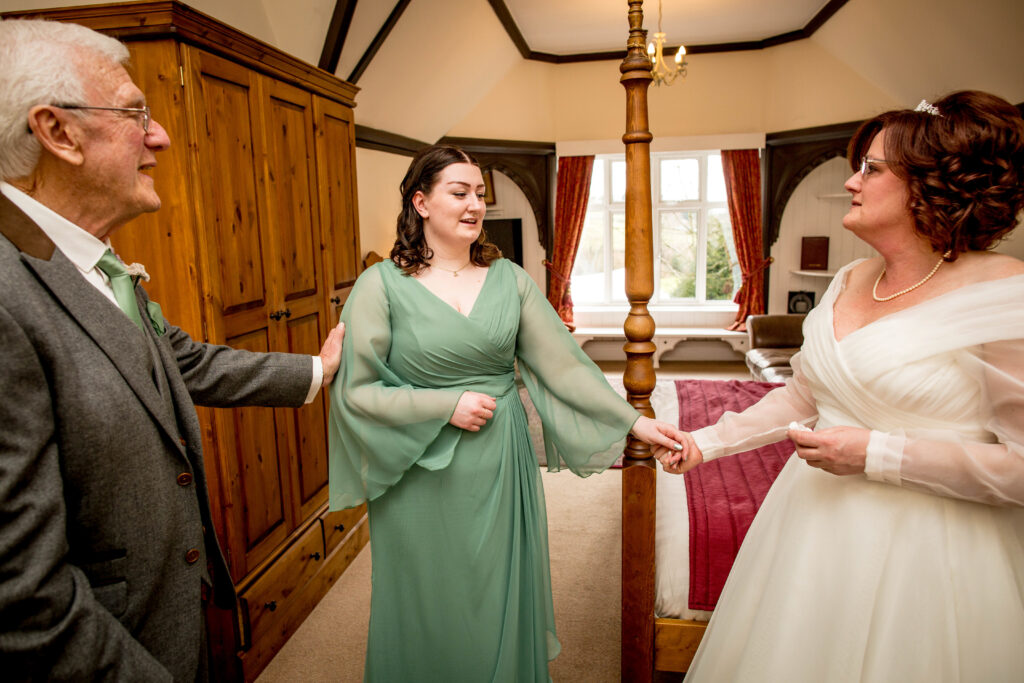 a bride, her daughter and her dad in one photo