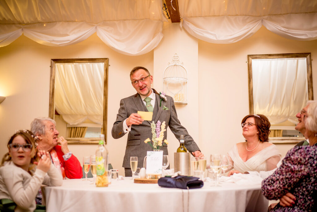 groom stood up giving his speech
