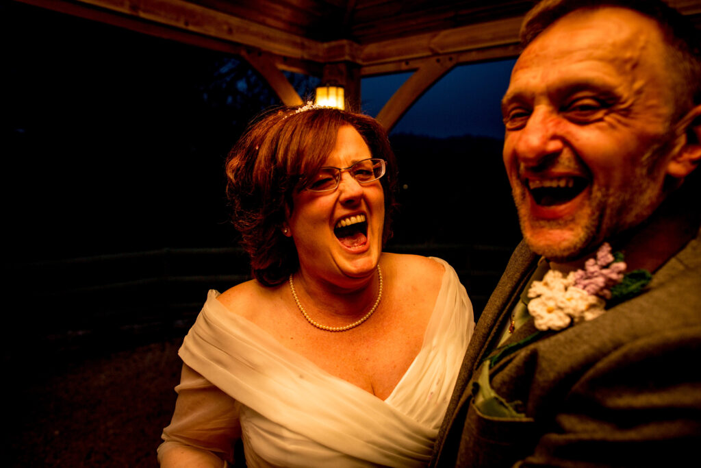 laughing bride and groom