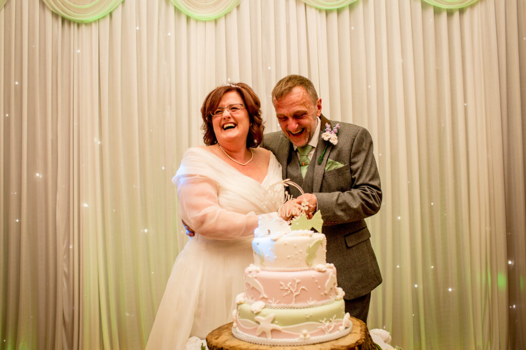 cake cutting by newly married couple