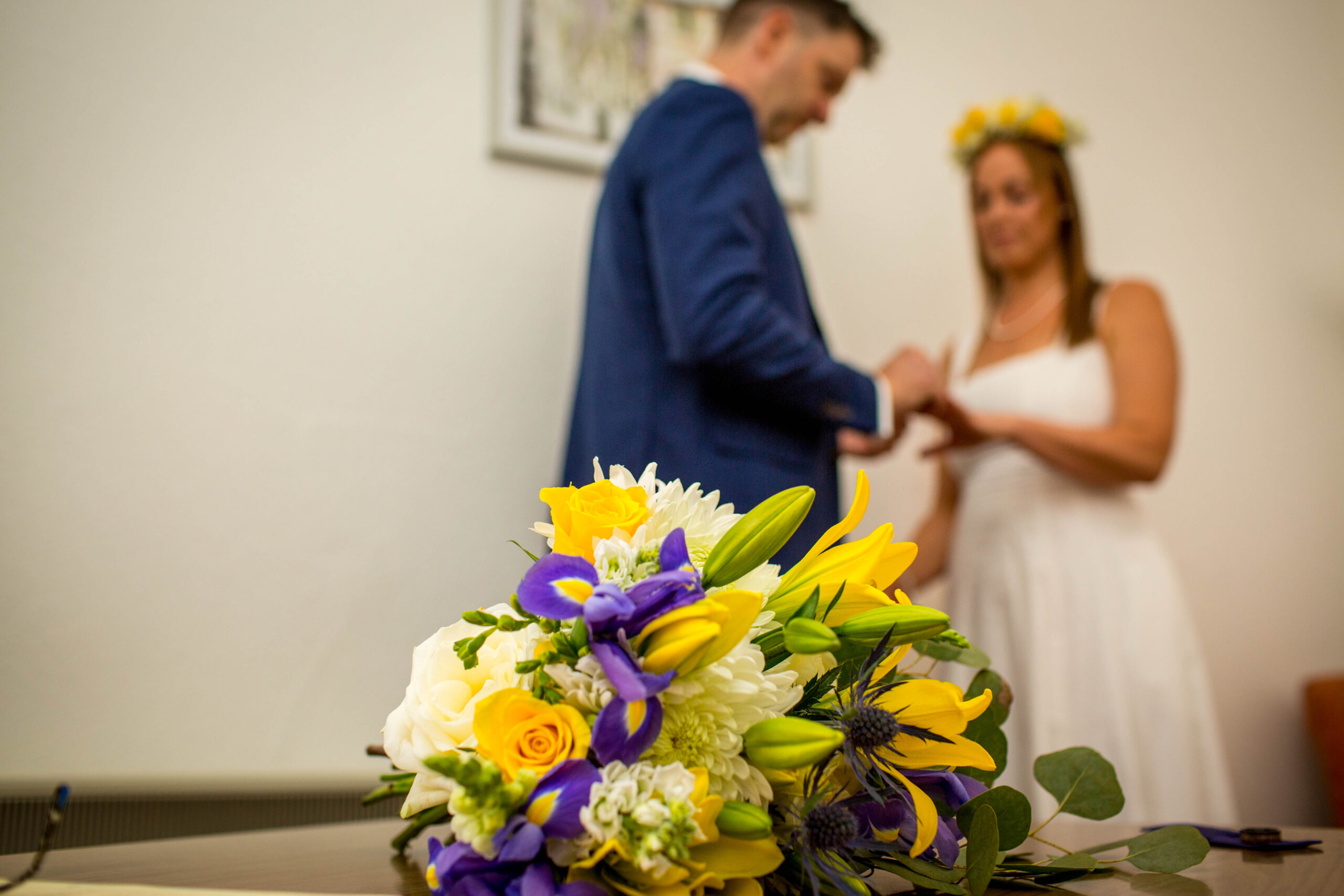 couple exchanging rings during wedding ceremony